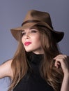 Beauty portrait. Beautiful young lady with a brown hat and black clothes Royalty Free Stock Photo