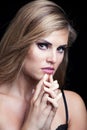 Beauty portrait of blonde girl with sparkly eye shadow Royalty Free Stock Photo