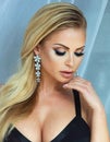 Beauty portrait of blonde woman with glamour makeup.