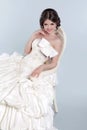 Beauty Portrait of bride wearing in wedding dress with voluminous skirt, studio photo Royalty Free Stock Photo