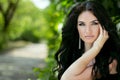 Beauty portrait of brunette model woman posing on nature background Royalty Free Stock Photo