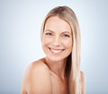 Beauty, portrait and face of a woman for skincare, health and wellness against a grey studio background. Front