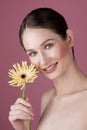 beauty portrait, gentle makeup, large portrait of girl with a flower, beautiful smile