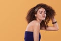 Beauty portrait of girl with afro hairstyle. Girl posing on yellow background, smiling. Studio shot. Royalty Free Stock Photo