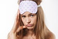 Beauty portrait of young half-naked woman wearing sleeping mask being sad Royalty Free Stock Photo