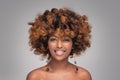 Beauty portrait of happy afro american woman with culry hairstyle and glamour colorful makeup Royalty Free Stock Photo