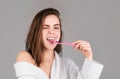 Beauty portrait of a happy beautiful woman brushing her teeth with a toothbrush isolated background. White tooth. Royalty Free Stock Photo