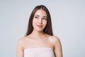 Beauty portrait of happy young beautiful asian woman with healthy dark long hair in top bando on white background isolated