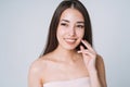 Beauty portrait of happy young beautiful asian woman with healthy dark long hair in top bando on white background isolated