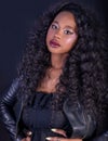 Close-up of beautiful young African model with curly long hair and red full lips Royalty Free Stock Photo