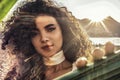 Beauty portrait of sensual hispanic woman on the beach during sunset.