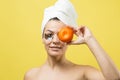 Beauty portrait of woman in white towel on head with gold nourishing mask on face. Skincare cleansing eco organic cosmetic spa rel Royalty Free Stock Photo