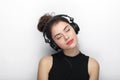 Beauty portrait of young adorable fresh looking brunette woman with closed eyes long brown healthy curly hair posing in big black Royalty Free Stock Photo