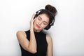 Beauty portrait of young adorable fresh looking brunette woman with closed eyes long brown healthy curly hair posing in big black Royalty Free Stock Photo