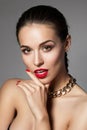 Beauty portrait of young aristocratic woman with red lips