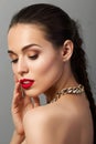 Beauty portrait of young aristocratic woman with red lips