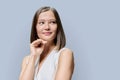 Beauty portrait of young woman with natural trendy makeup on grey background Royalty Free Stock Photo