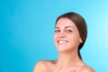 Beauty portrait of a young attractive half naked woman with perfect skin laughing and looking at camera isolated over Royalty Free Stock Photo