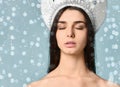 Beauty portrait of young attractive woman over snowy Christmas background Royalty Free Stock Photo