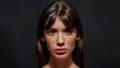 Beauty portrait of young brunette woman with brown eyes and colorful makeup looking at camera, posing isolated over Royalty Free Stock Photo