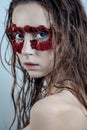 Beauty portrait of young fashion model with wet hairs and red fl Royalty Free Stock Photo