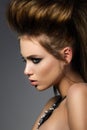 Beauty portrait of young glamorous woman with fashion hairdo Royalty Free Stock Photo