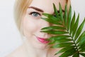 Beauty portrait of a young healthy attractive blonde woman standing isolated over white background, close up. Fashion, beauty, mak Royalty Free Stock Photo