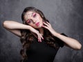 Beauty portrait of young woman. Brunette girl with evening female makeup and black T-shirt Royalty Free Stock Photo