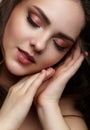 Beauty portrait of young woman. Brunette girl with evening female makeup and eyes closed Royalty Free Stock Photo