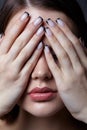 Beauty portrait of young woman with eyes closed and black french manicure Royalty Free Stock Photo