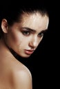 Beauty Portrait of Young Woman with Strobing Makeup Liquid on Fa