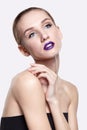 Beauty portrait of young woman with violet lips makeup