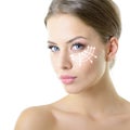 Beauty portrait of young woman with white lines on forehead for cosmetic medical procedures or plastic surgery