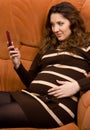 Beauty pregnant women reading sms