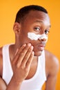 Beauty procedure and skin care, young manful man with face mask on around nose zone