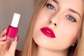Beauty product, makeup and cosmetics, face portrait of beautiful woman with nail polish, manicure and matching pink Royalty Free Stock Photo