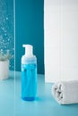 Beauty product mockup. Wellness packaging. Blue bottle, Cleaning cosmetic. Plastic pump bottle for and mousse or