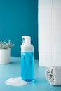 Beauty product mockup. Wellness packaging. Blue bottle, Cleaning cosmetic. Plastic pump bottle for and mousse or