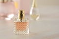 Beauty products. Perfume or parfume bottle on marble background. Copy space.