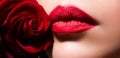 Beauty Red Lips Makeup Detail. Beautiful woman lips with rose. Royalty Free Stock Photo