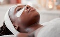 Beauty, relax and eye mask with black woman in spa for skincare, facial treatment and wellness. Health, peace and luxury