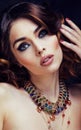 Beauty rich woman with bright makeup wearing luxury jewellery lo Royalty Free Stock Photo