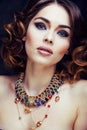 Beauty rich woman with bright makeup wearing luxury jewellery lo Royalty Free Stock Photo