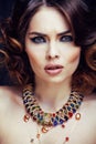 Beauty rich woman with bright makeup wearing luxury jewellery lo Royalty Free Stock Photo