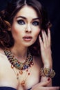 Beauty rich woman with bright makeup wearing luxury jewellery lo Royalty Free Stock Photo