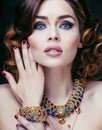 Beauty rich woman with luxury jewellery looks like mature Royalty Free Stock Photo