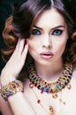 Beauty rich woman with luxury jewellery looks like mature Royalty Free Stock Photo