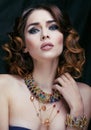 Beauty rich woman with luxury jewellery looks like mature close up, bright makeup Royalty Free Stock Photo