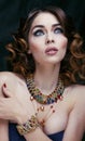 Beauty rich woman with luxury jewellery looks like mature close up, bright makeup Royalty Free Stock Photo