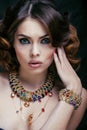 Beauty rich woman with luxury jewellery looks like mature close up, bright makeup Royalty Free Stock Photo